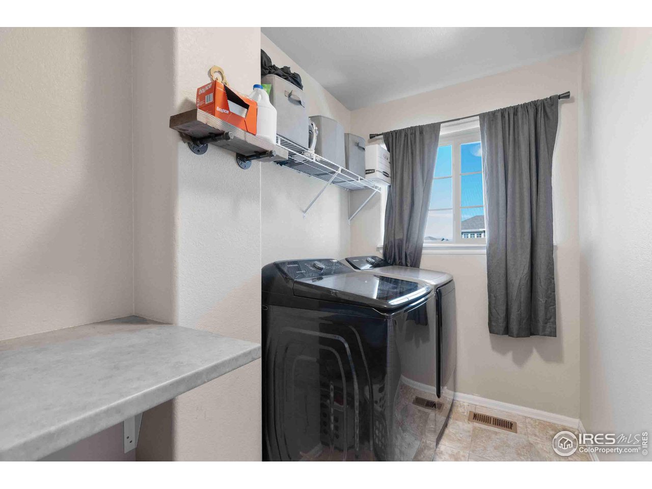 522 Lowland Street Severance, CO 80550 - Photo 19 of 30 a utility room with dryer and washer