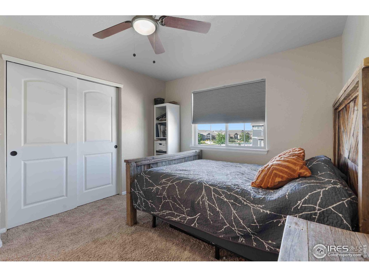 522 Lowland Street Severance, CO 80550 - Photo 21 of 30 a bedroom with a bed and a window