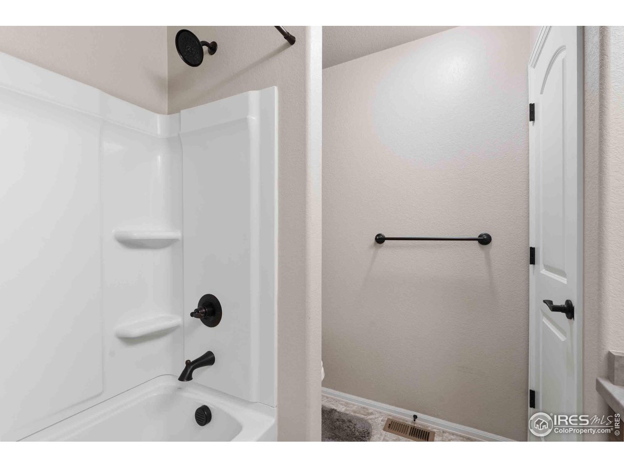 522 Lowland Street Severance, CO 80550 - Photo 25 of 30 a bathroom with a shower