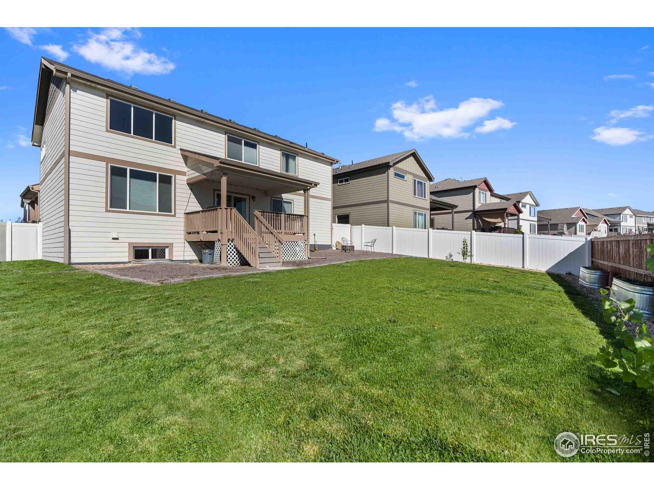 522 Lowland Street Severance, CO 80550 - Photo 28 of 30 a front view of a house with garden