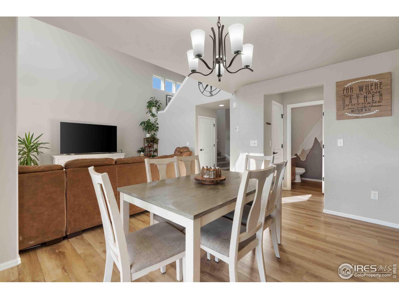 522 Lowland Street Severance, CO 80550 - Photo 7 of 30 a view of a dining room with furniture and wooden floor