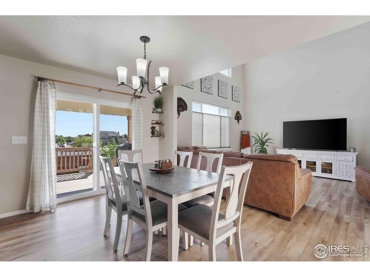 522 Lowland Street Severance, CO 80550 - Photo 8 of 30 a view of a dining room with furniture and wooden floor