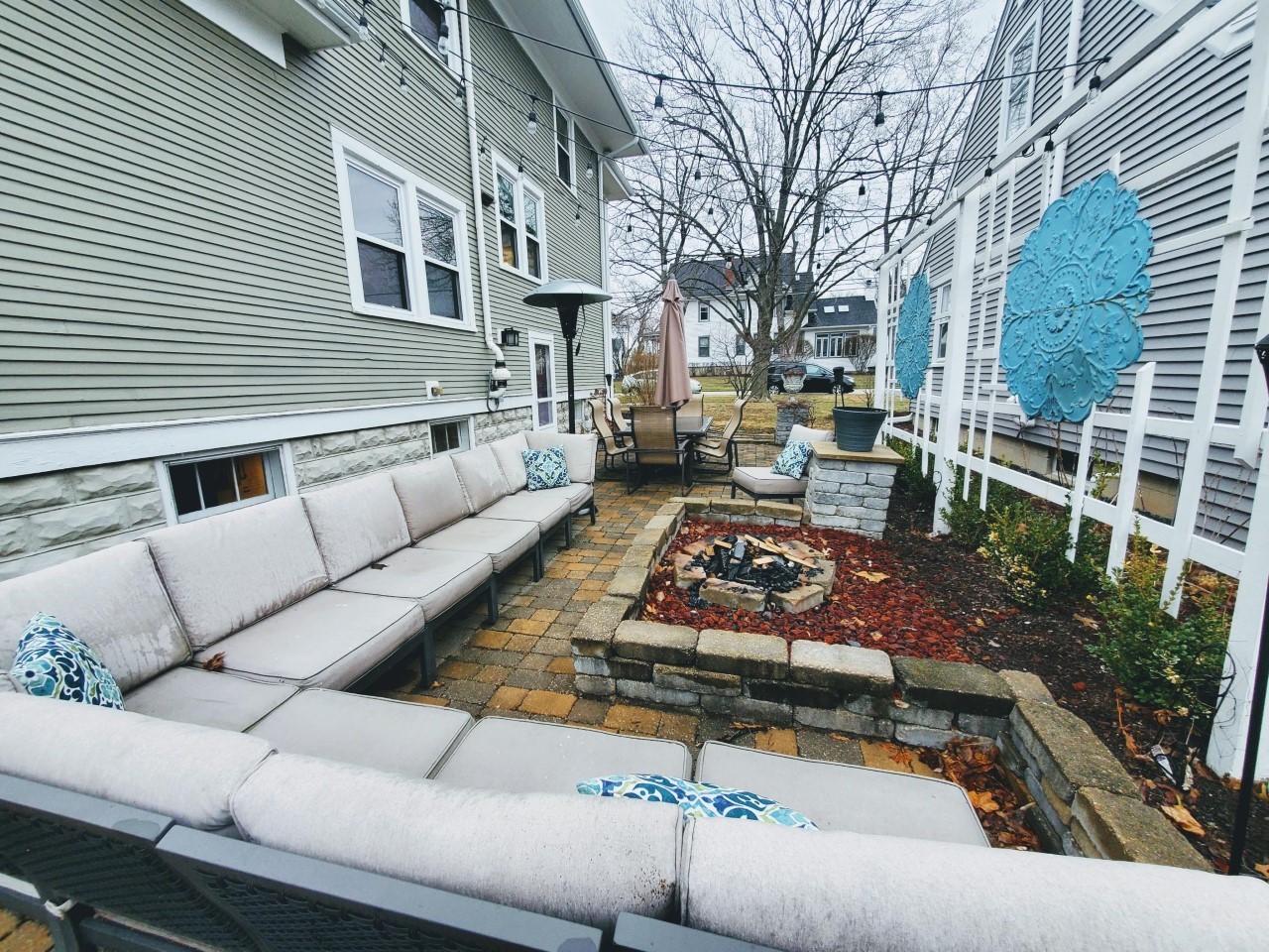 302 East Franklin Street Wheaton, IL 60187 - Photo 4 of 4 a view of a patio with couches table and chairs and potted plants