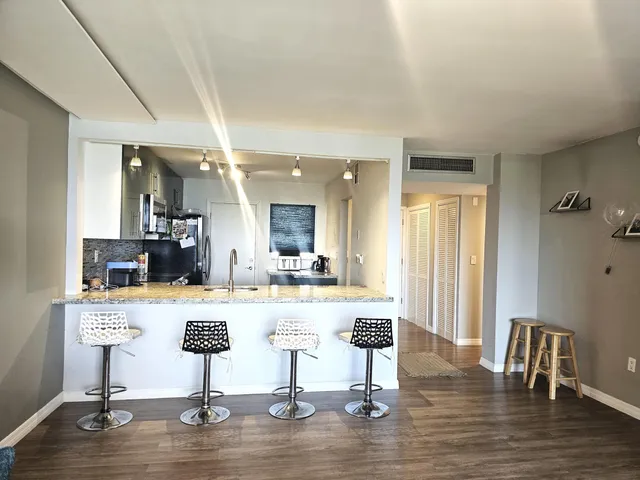 a living room with fireplace furniture and a flat screen tv