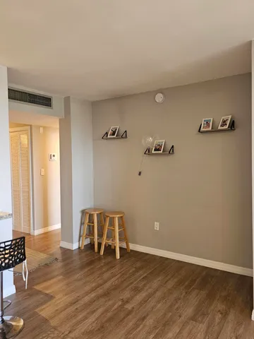 a view of a balcony with table and chairs
