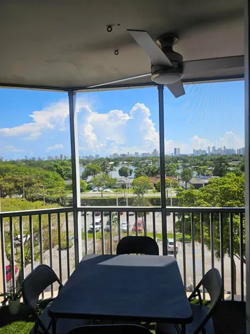 a bedroom with a bed window and wall painting