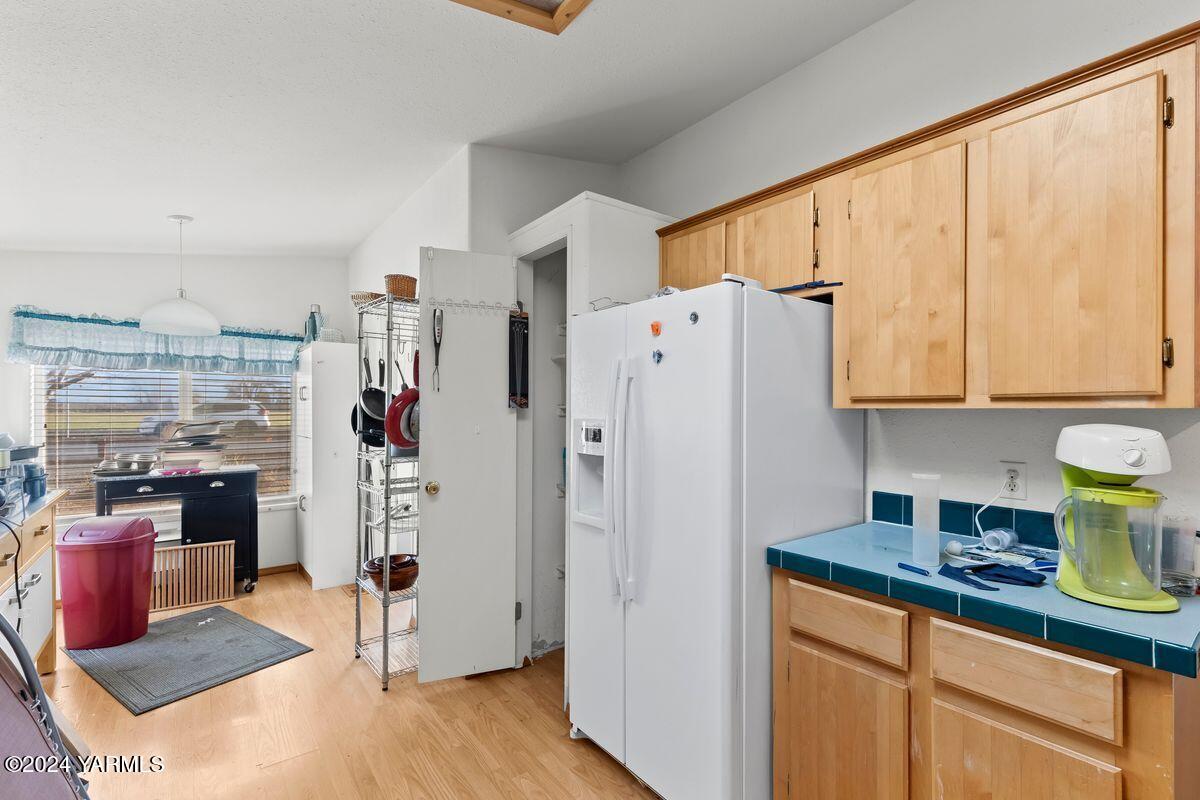 3780 Harrah Road Harrah, WA 98933 - Photo 6 of 26 a kitchen with stainless steel appliances granite countertop a refrigerator and a stove