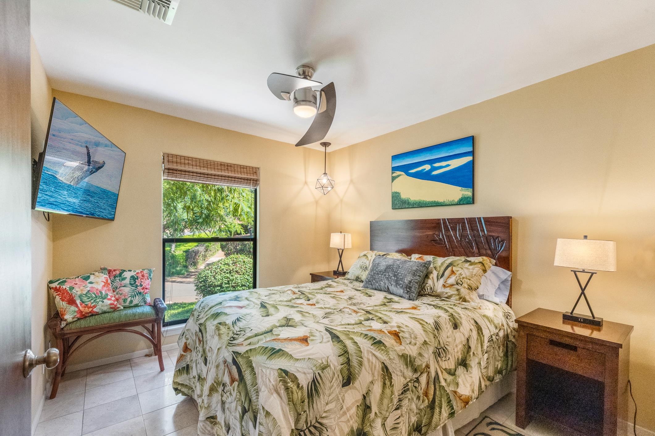150 Puukolii Road, Unit 18 Lahaina, HI 96761 - Photo 28 of 49 a bedroom with a bed and a chandelier