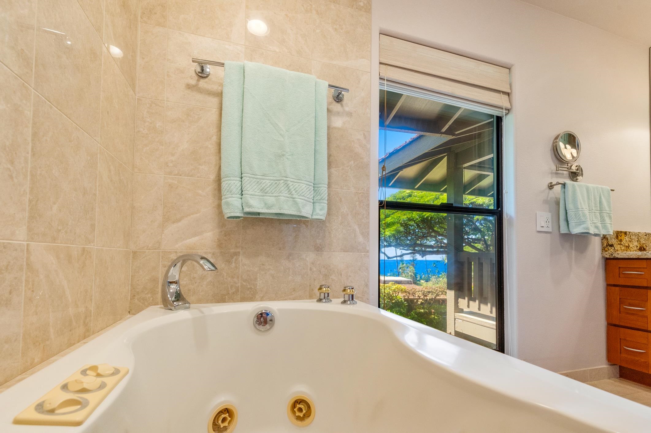 150 Puukolii Road, Unit 18 Lahaina, HI 96761 - Photo 32 of 49 a bathroom with a tub and shower