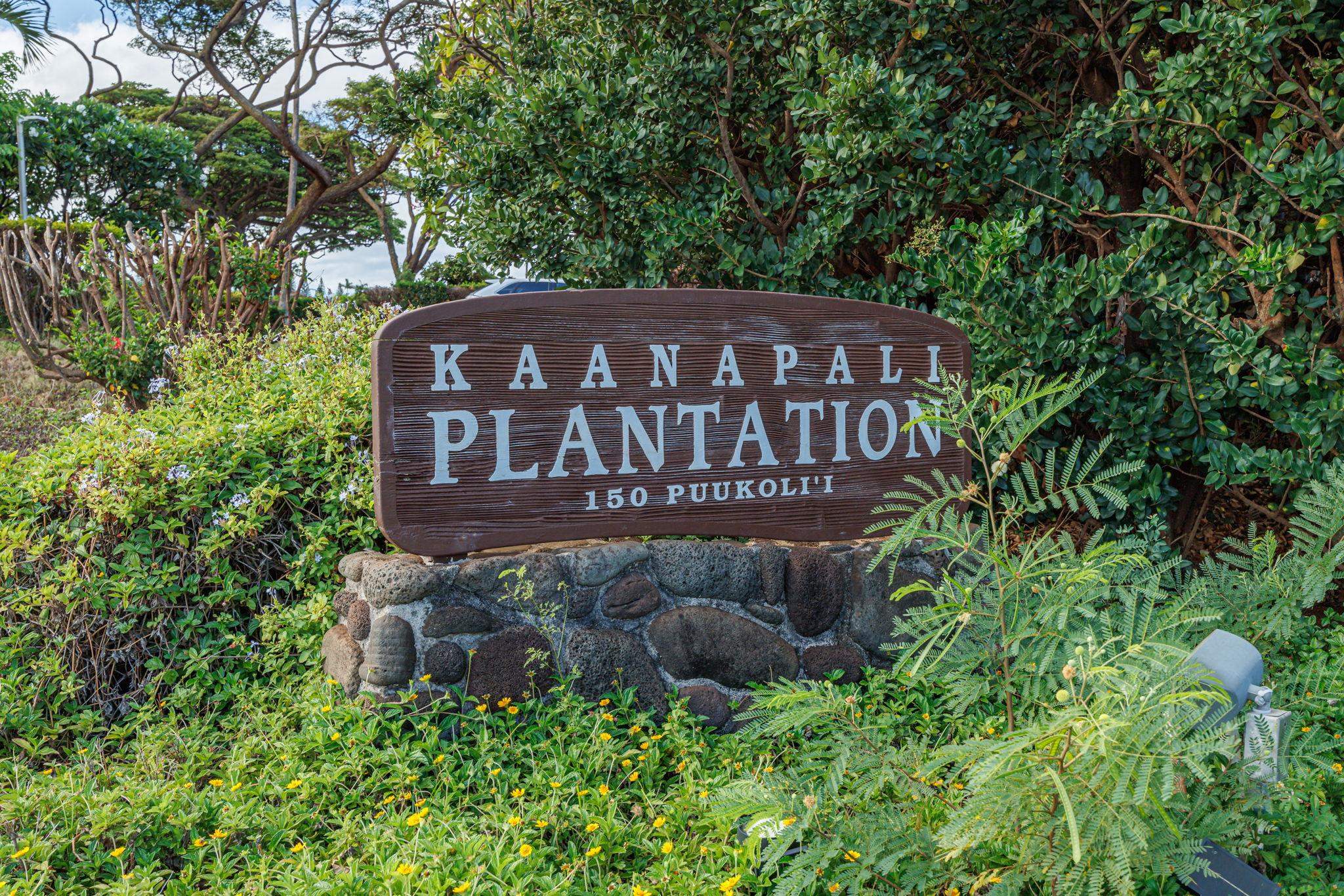 150 Puukolii Road, Unit 18 Lahaina, HI 96761 - Photo 43 of 49 a sign broad in front of the red brick house