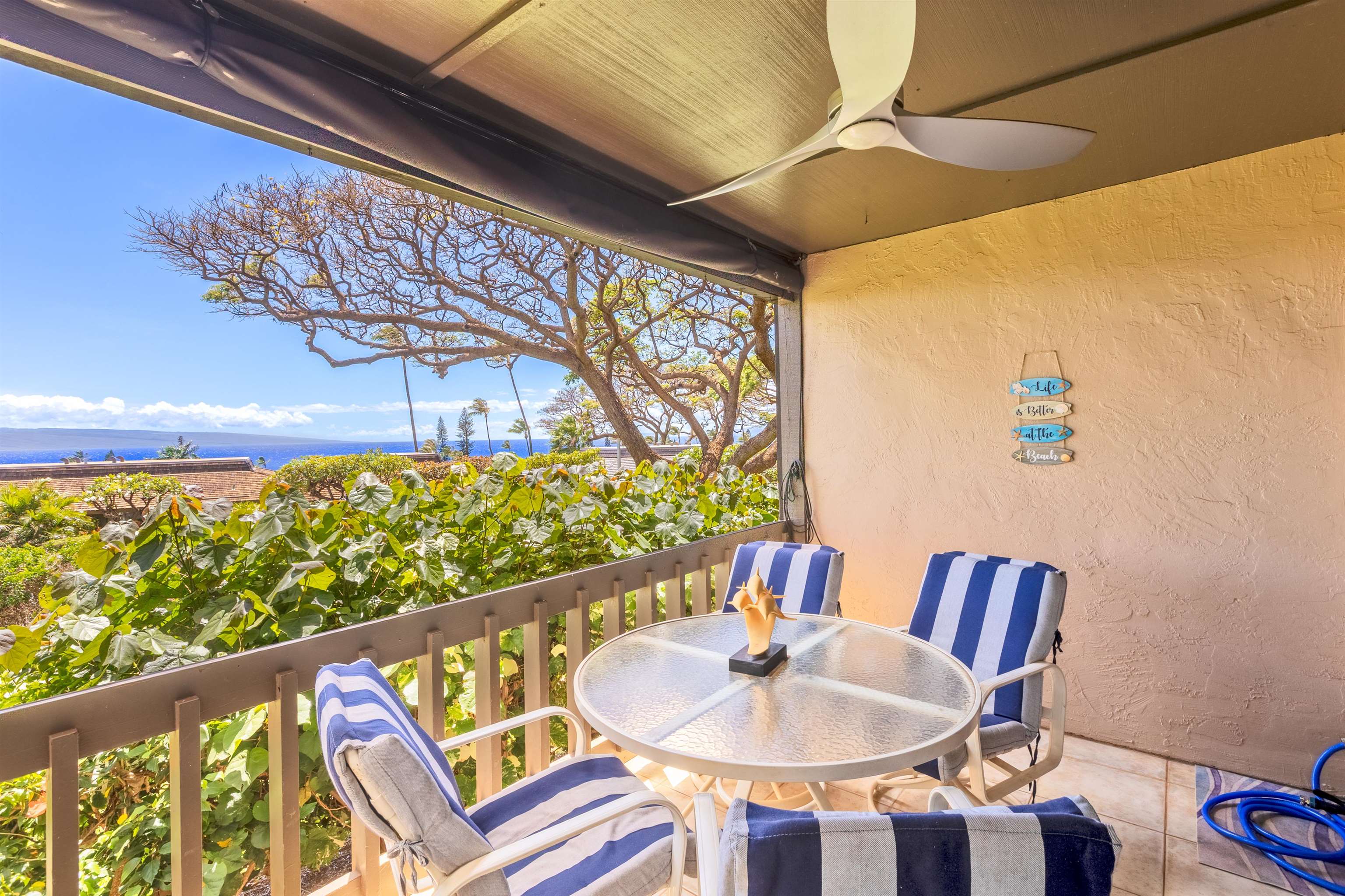 150 Puukolii Road, Unit 18 Lahaina, HI 96761 - Photo 45 of 49 a balcony with table and chairs