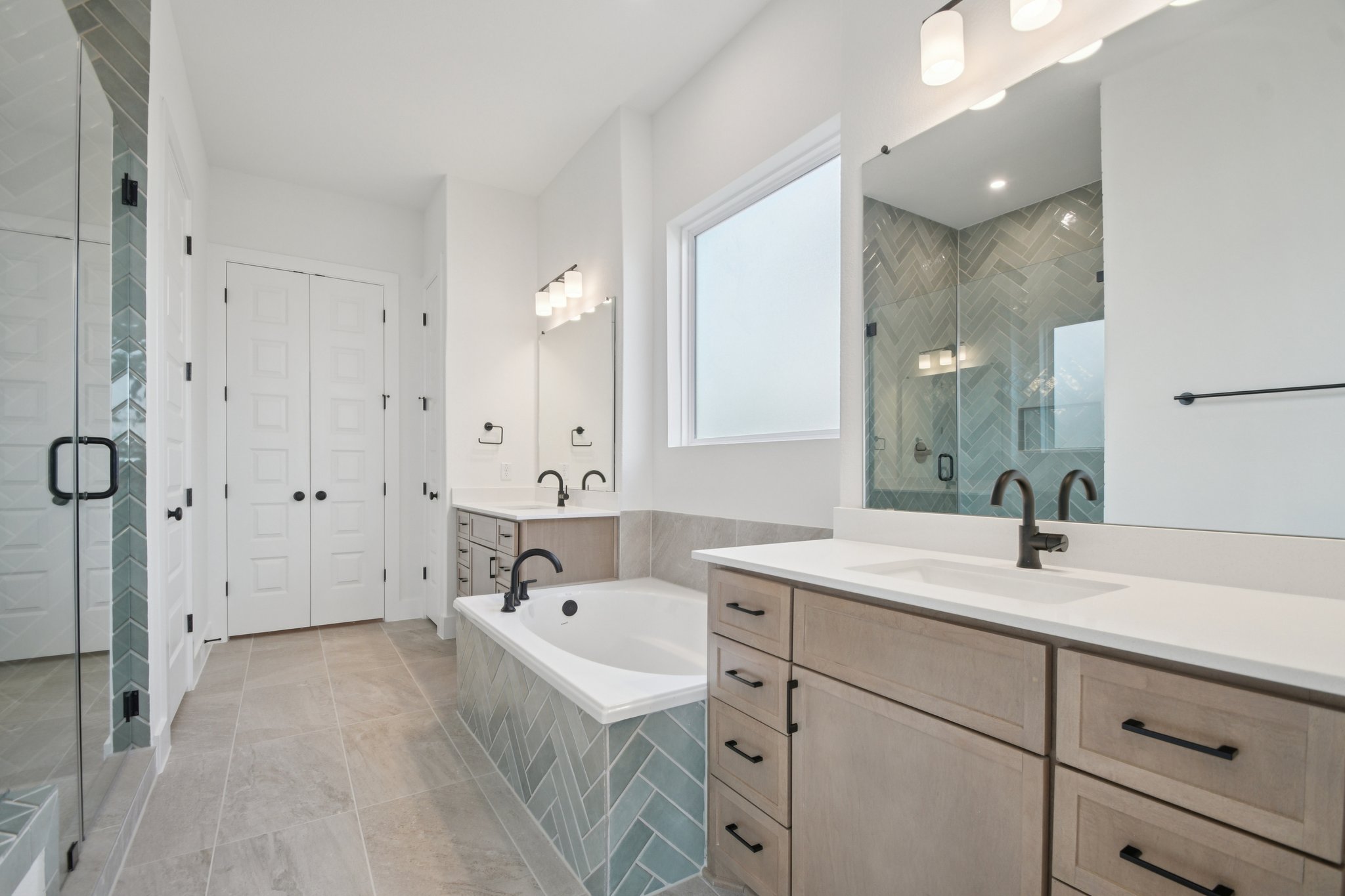 1660 Cardinal Lane Round Rock, TX 78681 - Photo 22 of 35 a bathroom with a sink double vanity granite tub shower and a mirror