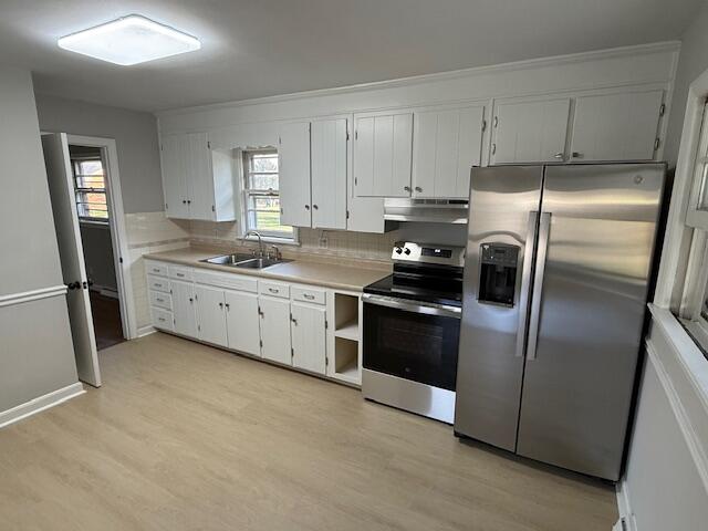 824 Coolbrook Road Vinton, VA 24179 - Photo 3 of 7 a kitchen with stainless steel appliances granite countertop a refrigerator a sink a stove and white cabinets