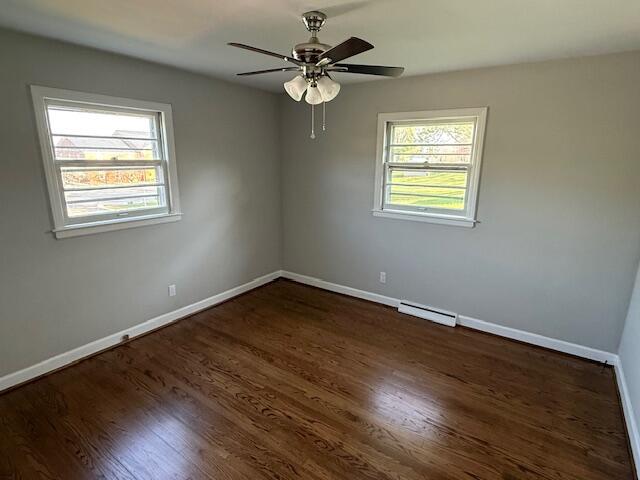 824 Coolbrook Road Vinton, VA 24179 - Photo 4 of 7 a view of an empty room with wooden floor and a window