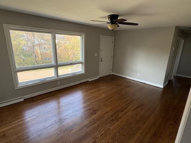 824 Coolbrook Road Vinton, VA 24179 - Photo 5 of 7 an empty room with wooden floor fan and windows