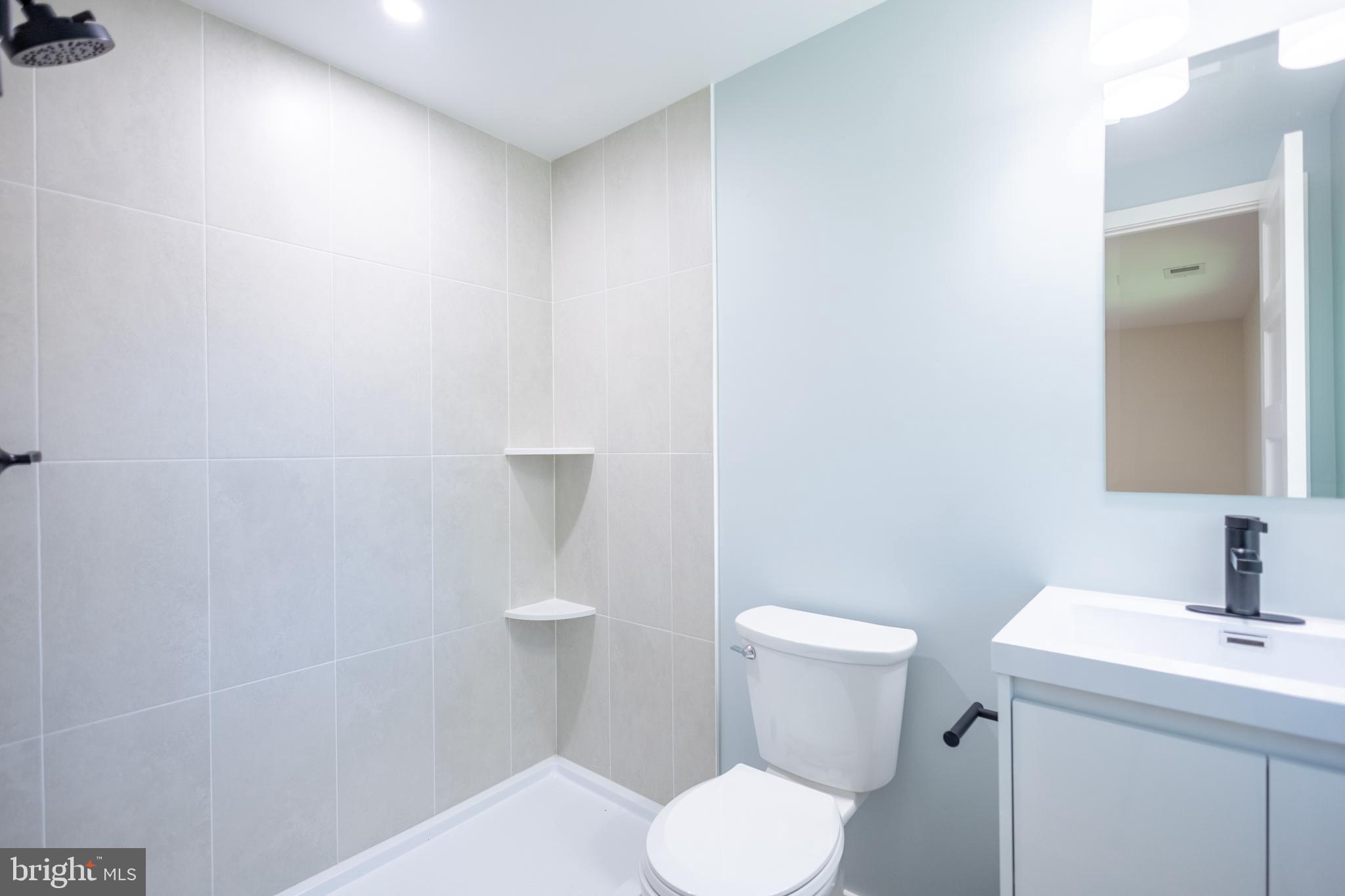 414 Venton Road Edgewater, MD 21037 - Photo 11 of 25 a white toilet sitting next to a bathroom sink