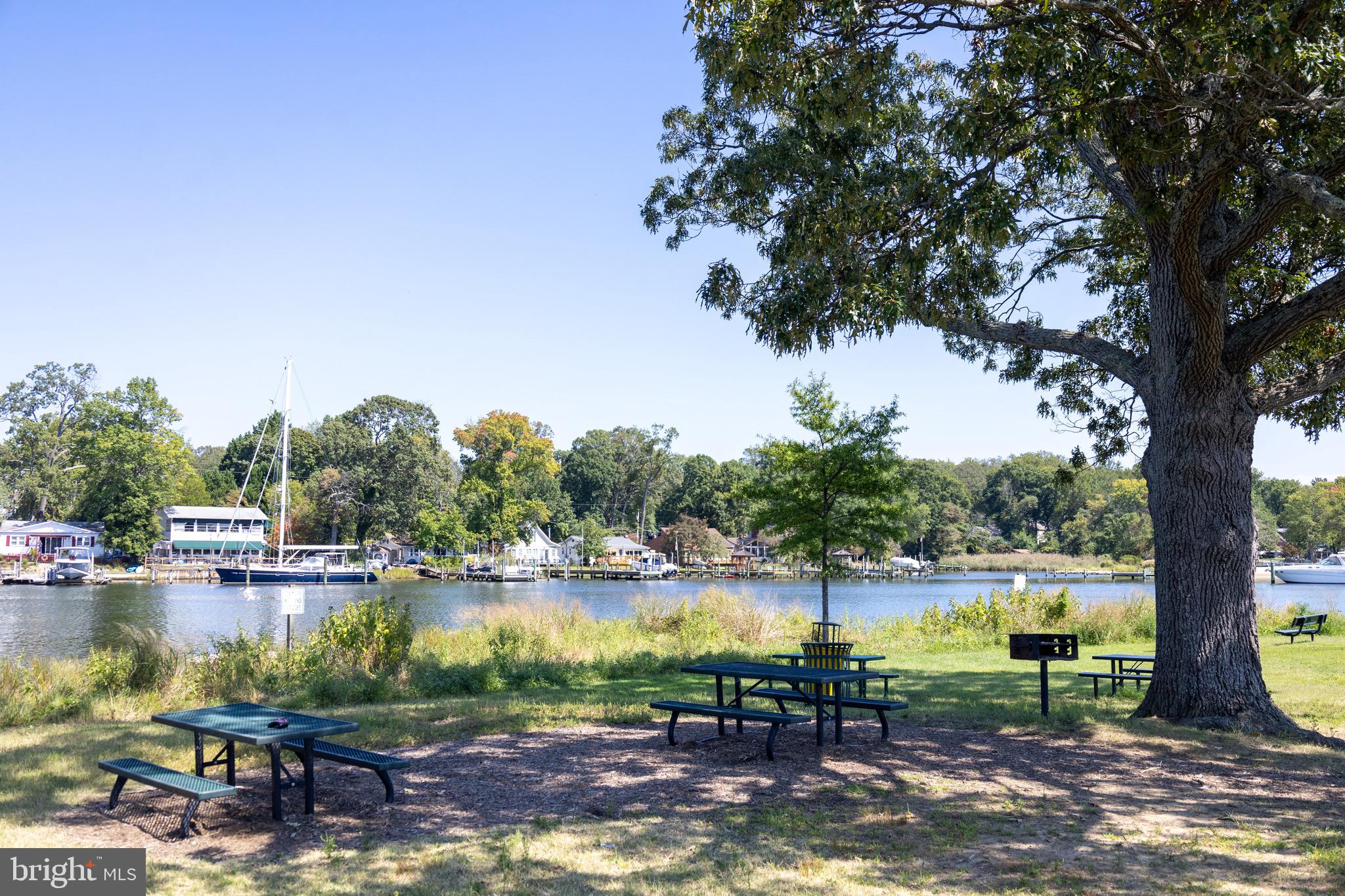 414 Venton Road Edgewater, MD 21037 - Photo 22 of 25 a view of a lake with houses in the back