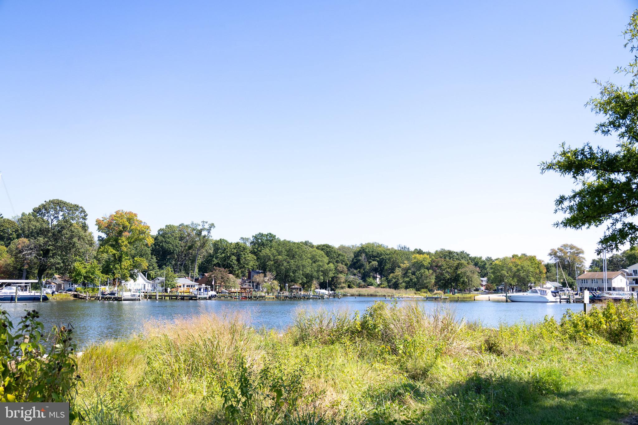 414 Venton Road Edgewater, MD 21037 - Photo 24 of 25 a view of a lake with houses in the back