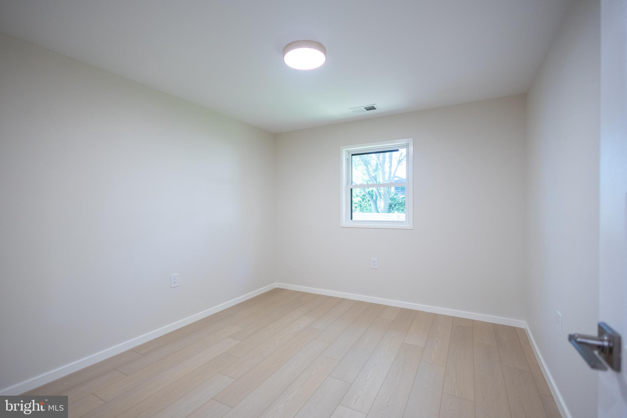 414 Venton Road Edgewater, MD 21037 - Photo 5 of 25 an empty room with a window