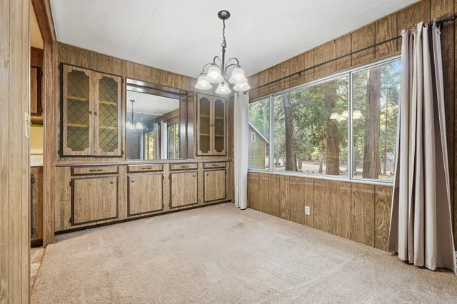 a view of a kitchen with cabinet oven kitchen view and a chandelier