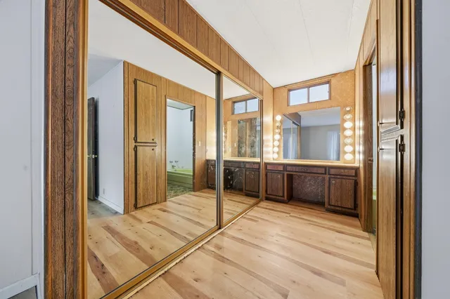 a view of a hallway with a chandelier