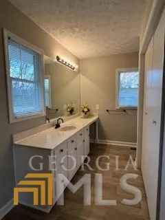 a bathroom with a sink double vanity and a mirror