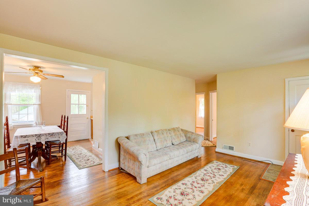 1022 Windsor Road Pikesville, MD 21208 - Photo 6 of 30 Living Room with gleaming wood floors.