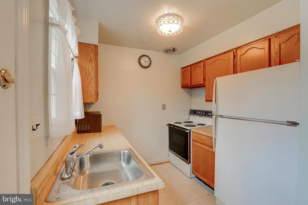 1022 Windsor Road Pikesville, MD 21208 - Photo 10 of 30 Kitchen wood cabinets.