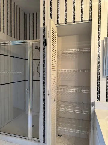 a view of a room with racks on the wall