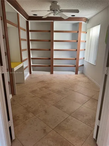 a view of a swimming pool with a patio and a garden