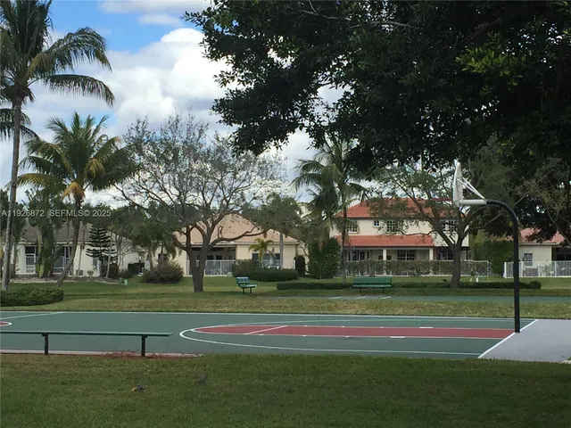a building view with palm trees