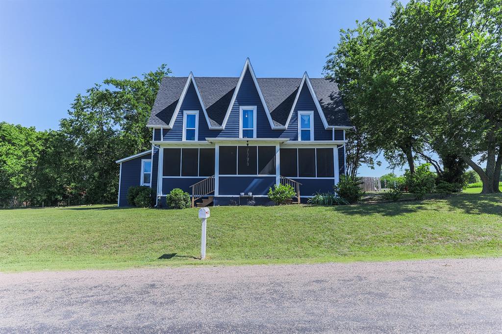453 East Marshall Street Van Alstyne, TX 75495 - Photo 2 of 30 a front view of a house with a yard and garage