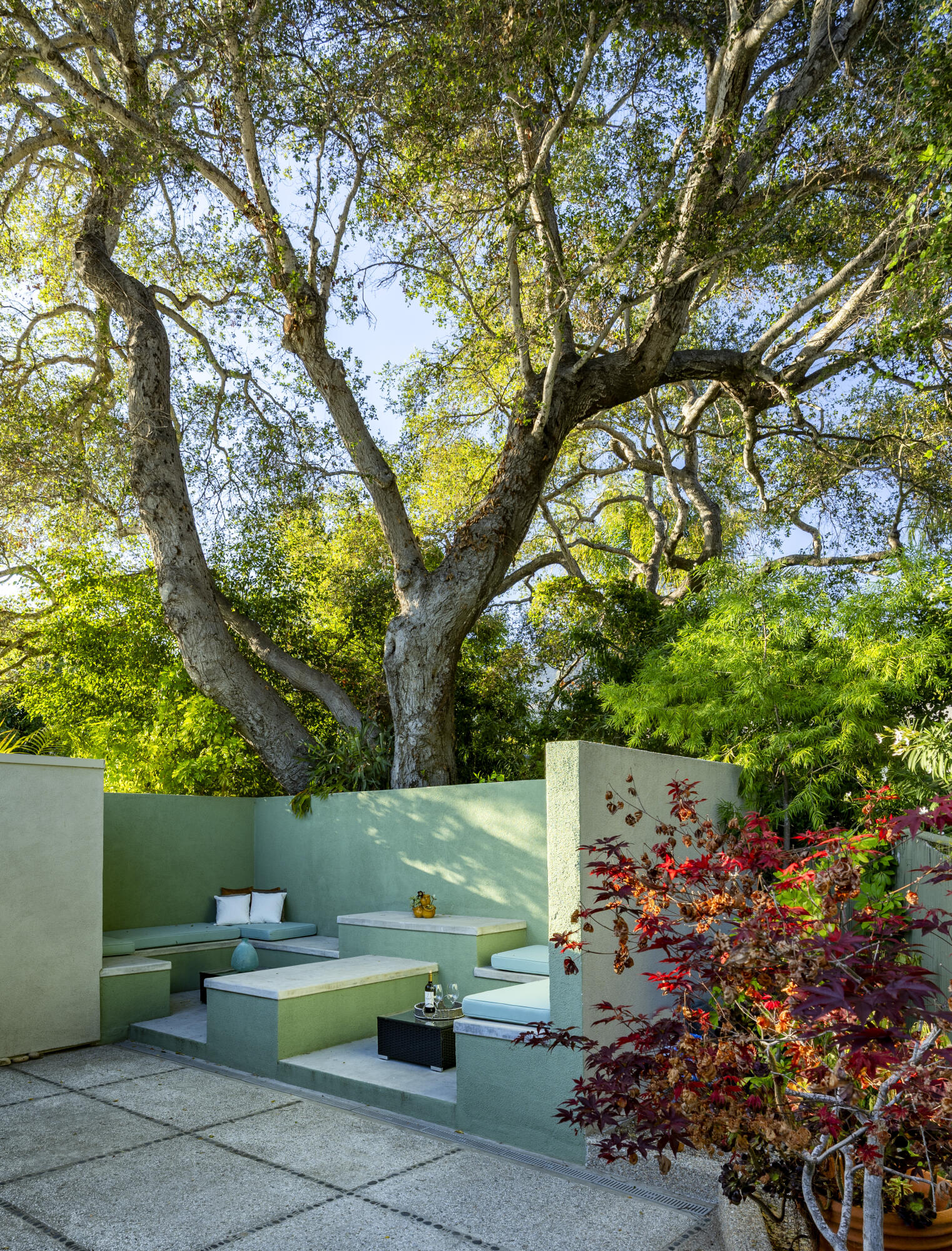 1524 East Valley Road Montecito, CA 93108 - Photo 16 of 19 a backyard of a house with lots of green space and fountain