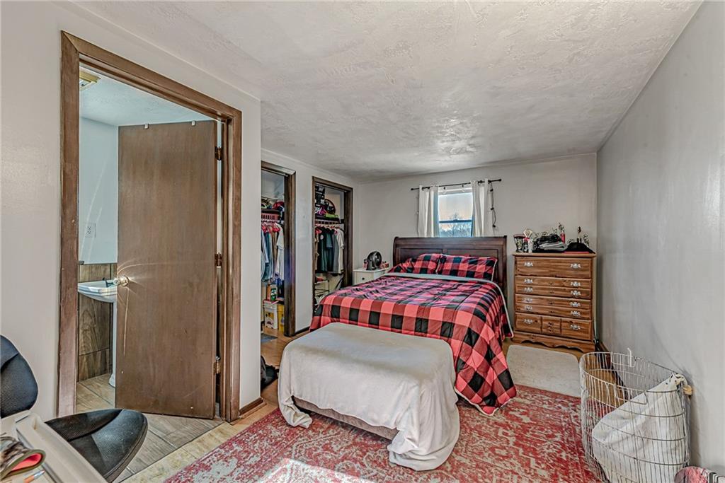 632 Hopewell Road White, PA 15490 - Photo 14 of 25 a bedroom with a bed and a closet