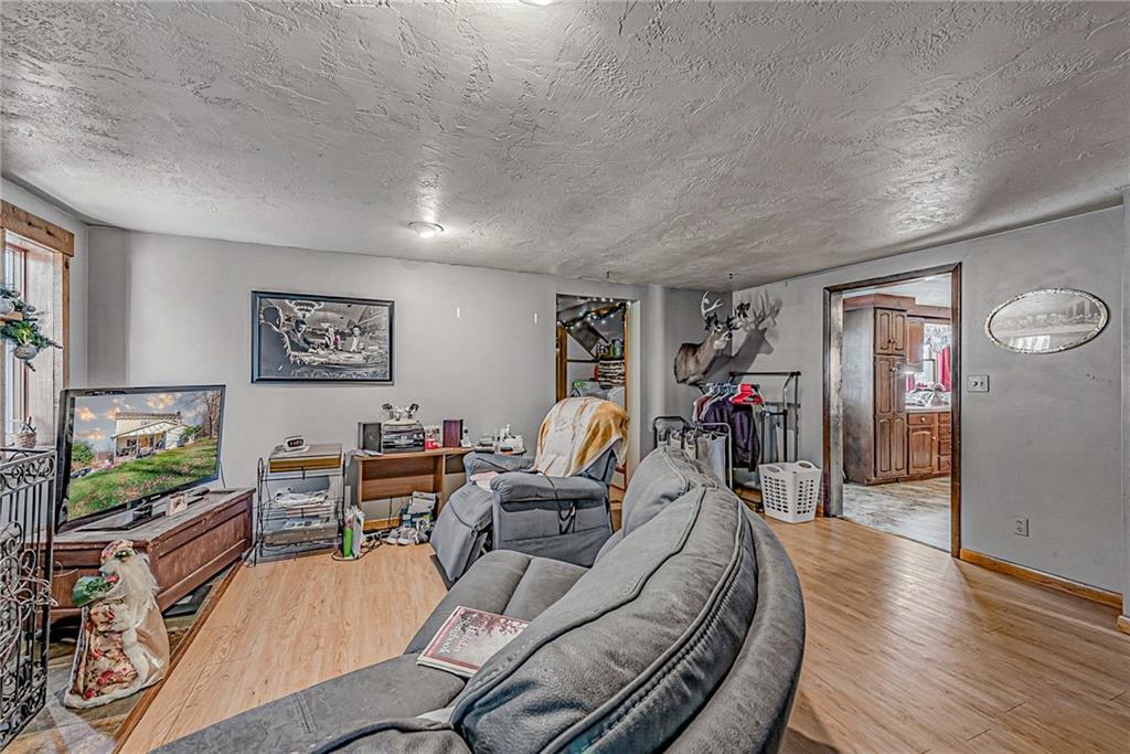 632 Hopewell Road White, PA 15490 - Photo 5 of 25 a living room with furniture and a flat screen tv