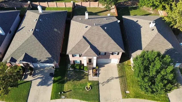 an aerial view of a house with garden