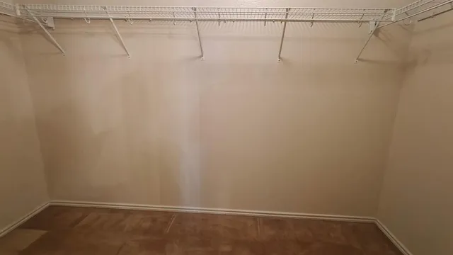 a view of a room with racks on the wall