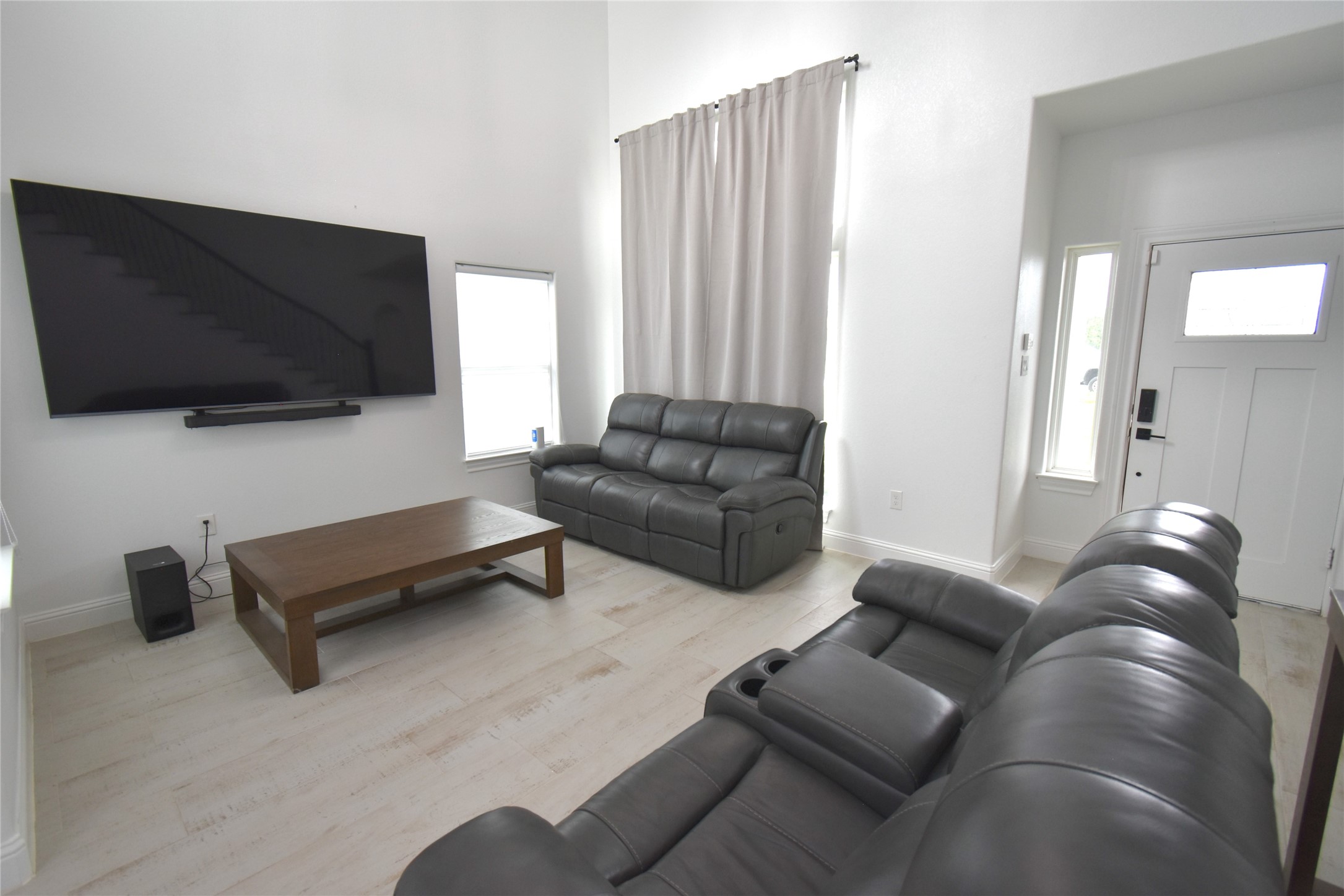 42 County Rd-5102L Cleveland, TX 77327 - Photo 4 of 9 a living room with furniture and a flat screen tv