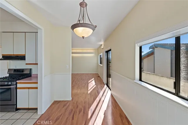 a view of a kitchen with a refrigerator cabinets and a window