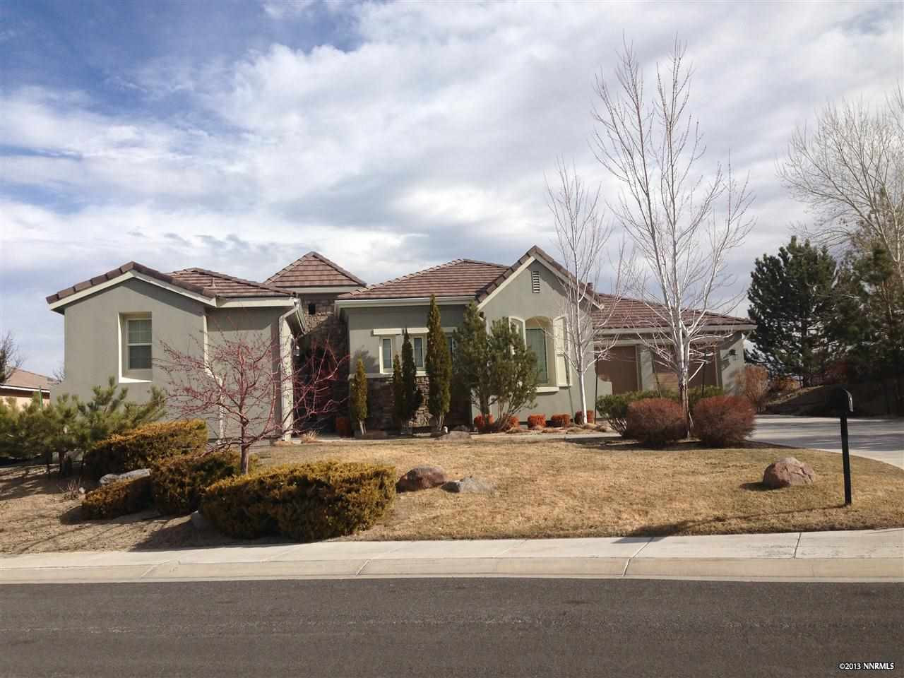 10114 Vía Verona Reno, NV 89511 - Photo 1 of 1 a view of a white house with a yard and potted plants