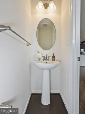 a bathroom with a sink a mirror and vanity