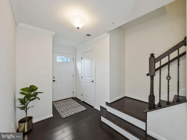 a view of room with window and wooden floor