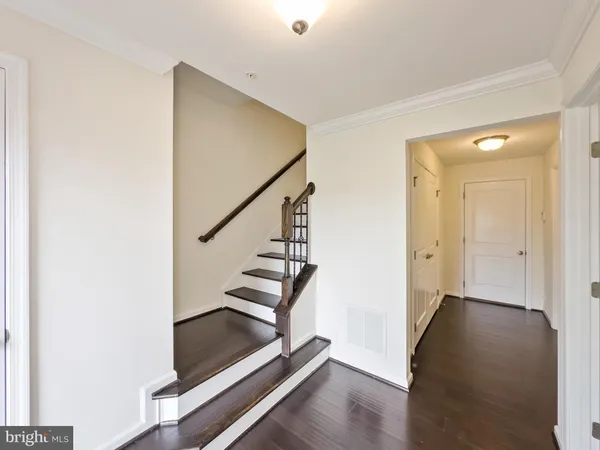 a view of entryway with wooden floor