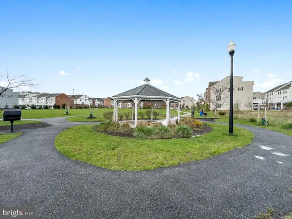 a view of a house with a yard and plants
