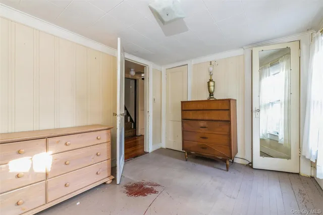 wooden view of walk in closet