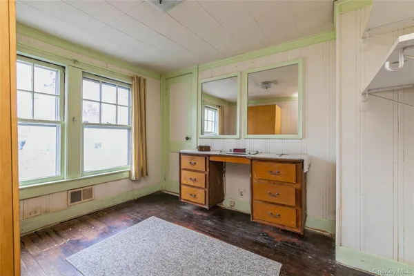 a bathroom with a sink mirror and a bathtub