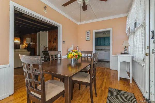 a dining room with furniture and window