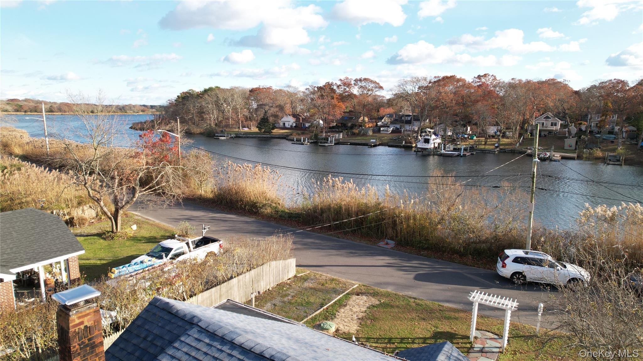 84 Riviera Drive Mastic, NY 11950 - Photo 28 of 28 Water view with nearby suburban area