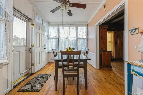 a view of a room with furniture window and wooden floor
