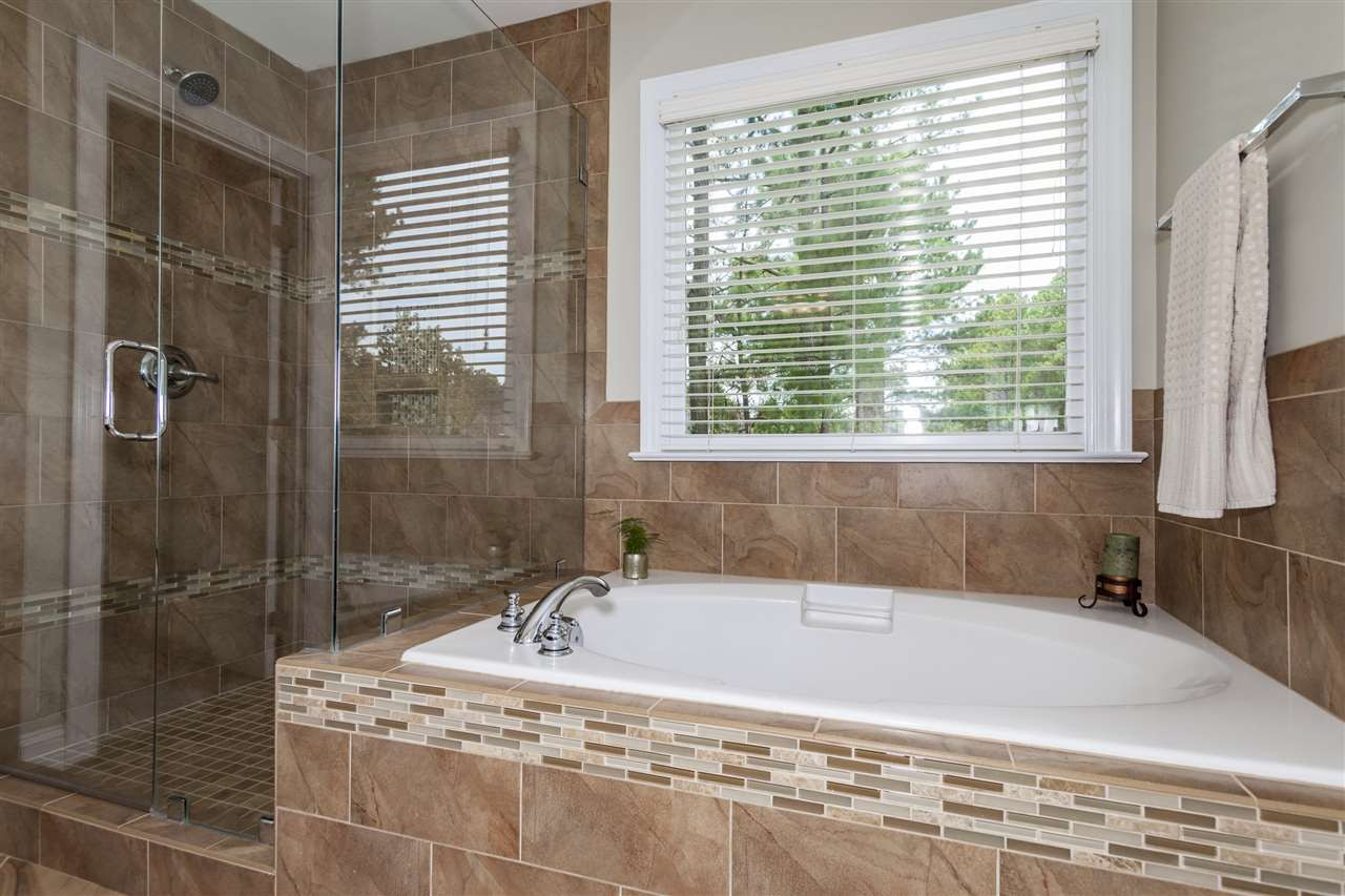 113 Rushing Wind Way Apex, NC 27502 - Photo 11 of 24 Tiled Shower and Soaking Tub!